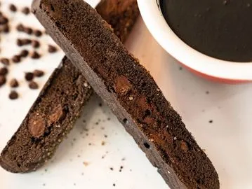 A close up of two pieces of chocolate cake