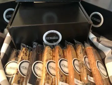 A box of some kind of bread with many different kinds