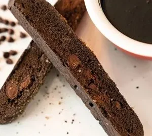 A close up of two pieces of chocolate cake